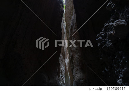 Dramatic narrow rock canyon passage in Karadakh Gorge, Dagestan, Russia Dramatic narrow rock canyon passage in Karadakh Gorge, Dagestan, Russia 139589415