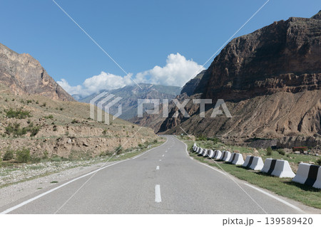 Mountain highway through canyon landscape in Dagestan with empty road and cliffs Mountain highway through canyon landscape in Dagestan with empty road and cliffs 139589420