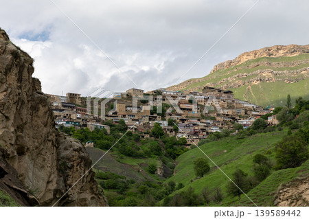 Mountain village of Chokh on hillside in Dagestan with dramatic cloudy sky 139589442