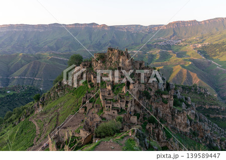 Abandoned mountain village ruins of Gamsutl on rocky ridge in Dagestan, Russia 139589447