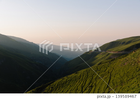 Mountain valley landscape with winding road at sunset in Dagestan, Caucasus region 139589467
