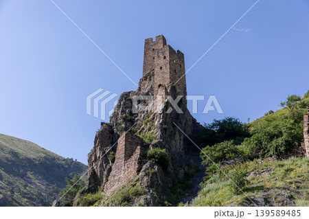 Vovnushki tower complex on rocky cliff in Ingushetia, Caucasus Mountains Vovnushki tower complex on rocky cliff in Ingushetia, Caucasus Mountains 139589485