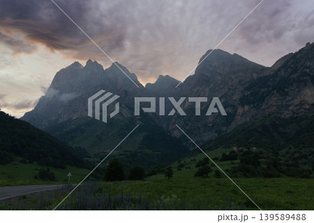 Dramatic sunset clouds over Galgai Gorge mountains and green valley landscape 139589488
