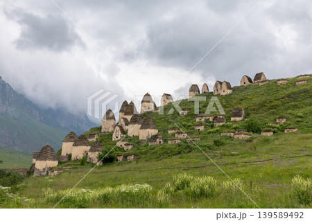 Dargavs City of the Dead ancient necropolis tombs on mountain hillside in Caucasus Dargavs City of the Dead ancient necropolis tombs on mountain hillside in Caucasus 139589492