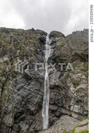 Midagrabin waterfalls cascading down steep rocky cliffs in Caucasus Mountains Midagrabin waterfalls cascading down steep rocky cliffs in Caucasus Mountains 139589496
