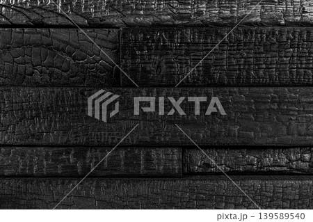 Yakisugi charred wood paneling with black texture Yakisugi charred wood paneling with black texture 139589540