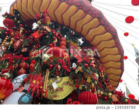 Chinese New Year decorations with red lanterns and festive ornaments at a crowded public space 139589789