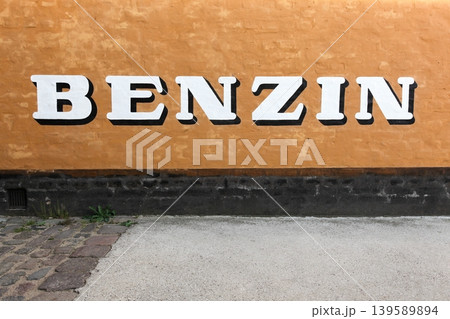 Gasoline sign on a wall in Denmark called benzin in Danish language 139589894