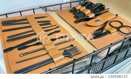 Professional manicure and grooming set with matte black tools in a stylish tan leather organizer case Professional manicure and grooming set with matte black tools in a stylish tan leather organizer case 139590137
