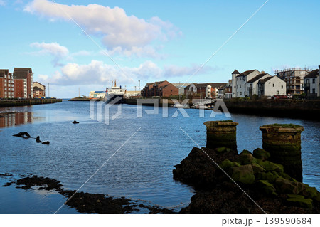 Passenger ferry and yachts moored at the mouth of the River Ayr in South West Scotland 139590684