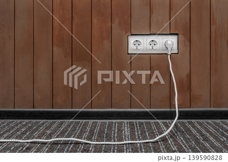 Connect power energy plug cable outlet brown wooden wall surface European design 139590828