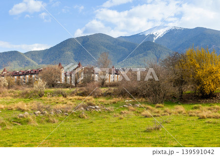 buildings in bansko, snowy pirin peaks in bulgaria buildings in bansko, snowy pirin peaks in bulgaria 139591042