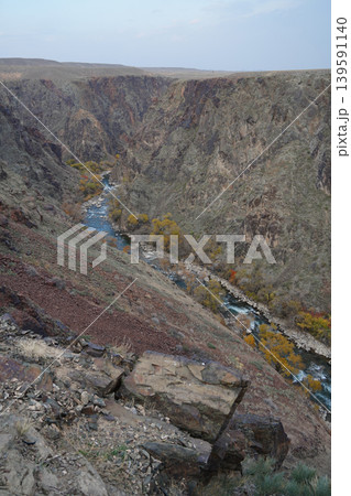 Deep rocky gorge of Black Canyon with flowing river in Charyn National Park 139591140