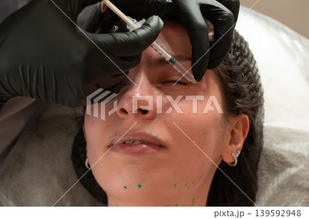 Cosmetologist Performing Facial Injection Procedure Close Up Cosmetologist Performing Facial Injection Procedure Close Up 139592948