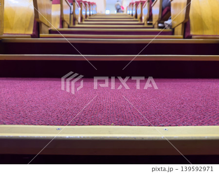 A view of the stairs in the theater auditorium, empty seats before the performance A view of the stairs in the theater auditorium, empty seats before the performance 139592971