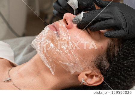 Facial Cleansing Procedure Close Up in Beauty Clinic Facial Cleansing Procedure Close Up in Beauty Clinic 139593026