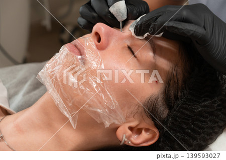 Facial Cleansing Procedure Close Up in Beauty Clinic Facial Cleansing Procedure Close Up in Beauty Clinic 139593027