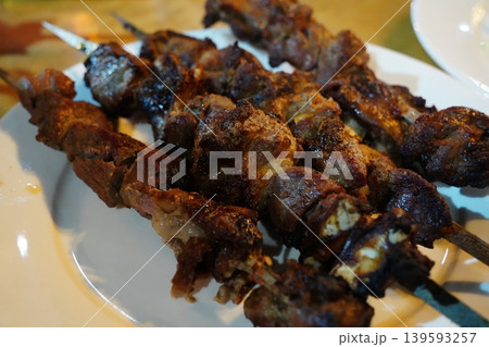 Grilled Lamb Shashlik Skewers on a White Plate Grilled Lamb Shashlik Skewers on a White Plate 139593257