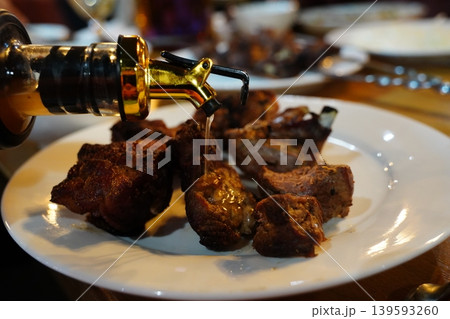 Grilled Lamb Shashlik Skewers on a White Plate Grilled Lamb Shashlik Skewers on a White Plate 139593260