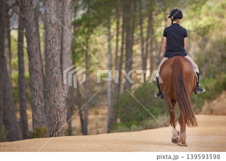 Equestrian, riding and horse on trail in nature on adventure and journey in countryside mockup. Ranch, animal and back of rider outdoor with pet on path in forest or woods for hobby on farm in summer Equestrian, riding and horse on trail in nature on adventure and journey in countryside mockup. Ranch, animal and back of rider outdoor with pet on path in forest or woods for hobby on farm in summer 139593598
