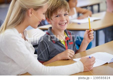Teacher, child portrait and classroom for learning, education and writing or language development with support. Happy woman teaching, helping and face of student with knowledge or questions at school Teacher, child portrait and classroom for learning, education and writing or language development with support. Happy woman teaching, helping and face of student with knowledge or questions at school 139593814