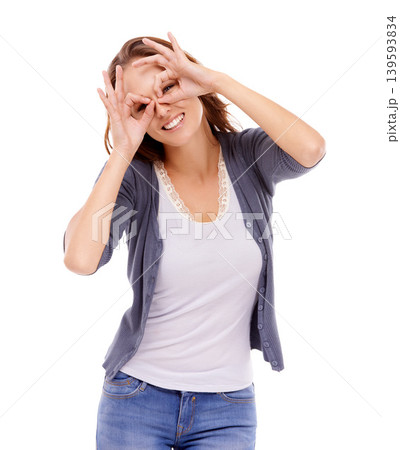 Portrait, fashion and finger glasses with woman in studio isolated on white background for silly style. Face, eyes and smile with happy young model in trendy, casual or relaxed clothes outfit Portrait, fashion and finger glasses with woman in studio isolated on white background for silly style. Face, eyes and smile with happy young model in trendy, casual or relaxed clothes outfit 139593834