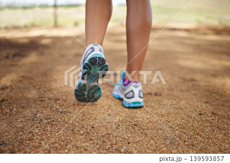 Person, feet and outdoor fitness in nature for exercise, wellness and running competition for cardio workout. Legs, training sneakers and jog in countryside with sport and strong for marathon in park Person, feet and outdoor fitness in nature for exercise, wellness and running competition for cardio workout. Legs, training sneakers and jog in countryside with sport and strong for marathon in park 139593857