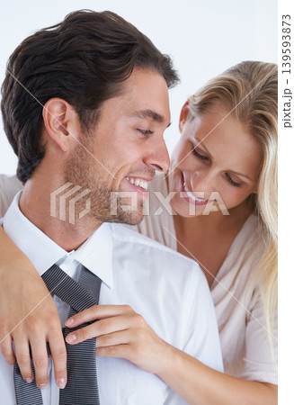 Smile, love and tie with couple dressing together in morning for help, romance or bonding. Fashion, style or clothes and businessman getting ready for work with wife in studio on white background 139593873