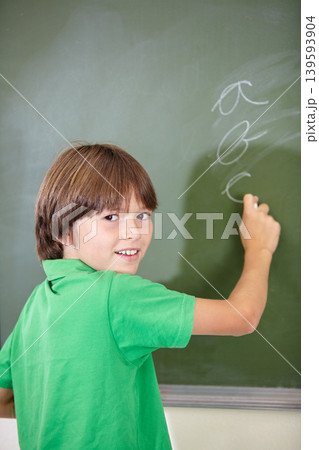 Portrait, knowledge and boy drawing on a chalkboard for child development, creativity and art for learning. Academic, face and kid student writing with information in the classroom and answers 139593904