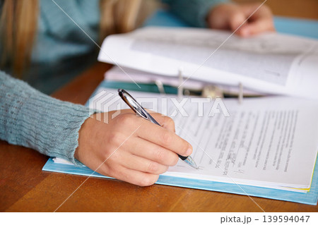 Hands, teacher and marking a test with education, review and feedback in a classroom, learning and study. Person, educator or woman with pen, checking exams or writing with results, closeup or school Hands, teacher and marking a test with education, review and feedback in a classroom, learning and study. Person, educator or woman with pen, checking exams or writing with results, closeup or school 139594047