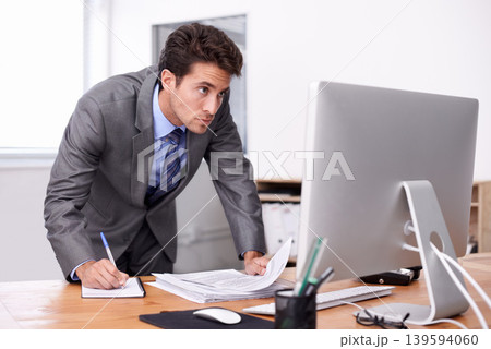 Business man, writing notes and computer for planning, reading report and planning and documents review. Accountant or auditor with notebook, bookkeeping paperwork and priority or list in his office 139594060