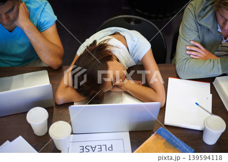 Classroom, students and high school girl for sleeping, laptop and tired with books, development or academy. Teenager, burnout and rest for learning, fatigue or scholarship with education assessment 139594118