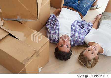 Couple, boxes and happy with face for real estate, new home or property investment with romance or love. Moving, man and woman with smile or holding hands for fresh start, achievement and dream house Couple, boxes and happy with face for real estate, new home or property investment with romance or love. Moving, man and woman with smile or holding hands for fresh start, achievement and dream house 139594184