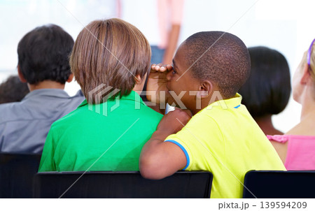 Little boys, whisper and classroom in ear for secret, gossip or communication at school. Male person, students or friends listening to rumor, information or surprise in class together with teacher 139594209