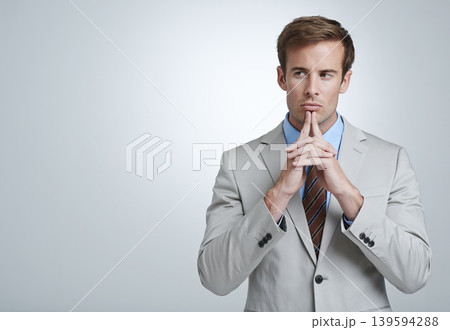 Business man, thinking and planning in studio, brainstorming and problem solving by white background. Male person, professional and mockup for ideas, contemplating solution and decision or choice 139594288