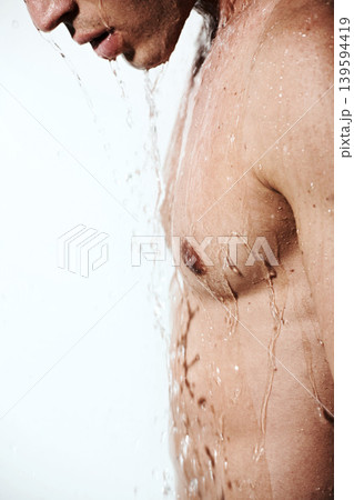 Chest of man in shower to relax, cleaning hair and body for morning wellness, hygiene and skin routine. Grooming, skincare and male model with muscle washing with water, self care and calm bathroom. Chest of man in shower to relax, cleaning hair and body for morning wellness, hygiene and skin routine. Grooming, skincare and male model with muscle washing with water, self care and calm bathroom. 139594419