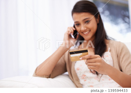 Happy woman, phone call and credit card for banking, online shopping or payment on sofa at home. Female person talking on mobile smartphone with smile for ecommerce, debit or conversation on account Happy woman, phone call and credit card for banking, online shopping or payment on sofa at home. Female person talking on mobile smartphone with smile for ecommerce, debit or conversation on account 139594433