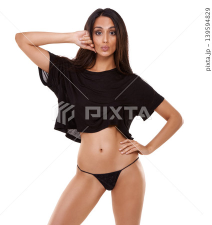 Woman, confident and lingerie portrait in studio with gesture and body glow for fashion or summer style. Indian, model and face expression for bare tummy and thong underwear by white background Woman, confident and lingerie portrait in studio with gesture and body glow for fashion or summer style. Indian, model and face expression for bare tummy and thong underwear by white background 139594829
