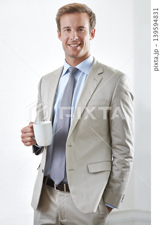 Businessman, portrait and drinking coffee in office, smile and pride for career and confidence. Male person, face and professional with cup of tea, entrepreneur and happy for startup and beverage 139594831