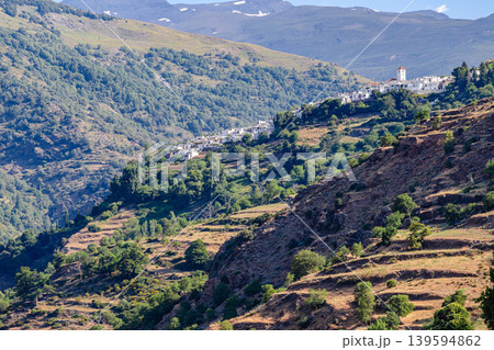 Picturesque view of a village Pampaneira located on a mountainside in the Sierra Nevada region of Spain Picturesque view of a village Pampaneira located on a mountainside in the Sierra Nevada region of Spain 139594862