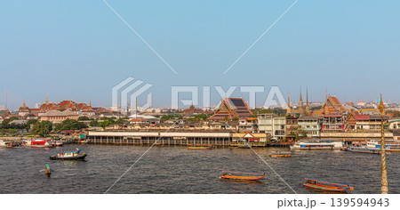 Cityscape view of riverside temples and boats during daytime in Bangkok, Thailand 139594943