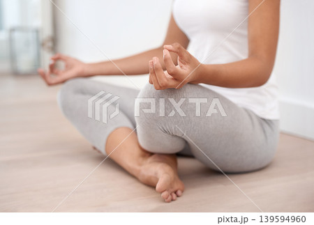 Woman hands, meditation and spiritual in a home with mockup space and chakra for balance and mindfulness. Morning, wellness and zen in house on floor to relax for calm and peace in lotus position Woman hands, meditation and spiritual in a home with mockup space and chakra for balance and mindfulness. Morning, wellness and zen in house on floor to relax for calm and peace in lotus position 139594960