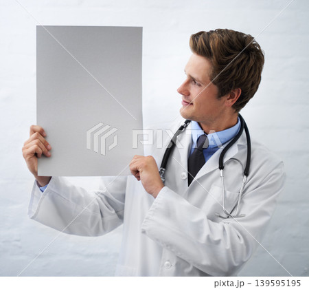 Man, doctor and billboard in healthcare for advertising or marketing on a white studio background. Male person, nurse or medical surgeon holding empty poster or blank sign for message on mockup space Man, doctor and billboard in healthcare for advertising or marketing on a white studio background. Male person, nurse or medical surgeon holding empty poster or blank sign for message on mockup space 139595195