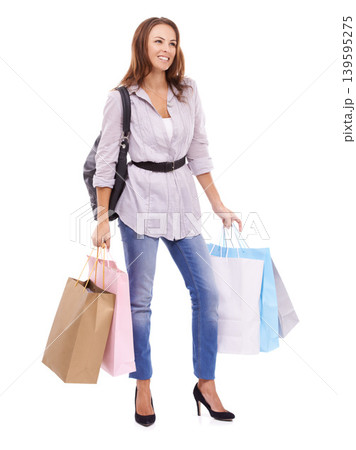 Fashion, shopping bags and young woman in studio with elegant, trendy and stylish outfit for confidence. Happy, thinking and beautiful female customer with style purchase isolated by white background Fashion, shopping bags and young woman in studio with elegant, trendy and stylish outfit for confidence. Happy, thinking and beautiful female customer with style purchase isolated by white background 139595275