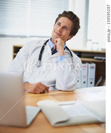 Computer, thinking and man doctor in his office for consultation with brainstorming for diagnosis treatment. Ideas, laptop and professional young male healthcare worker with decision face at hospital 139595287