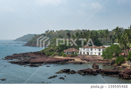 Guesthouses and palm trees on the coast of Goa India. Guesthouses and palm trees on the coast of Goa India. 139595488