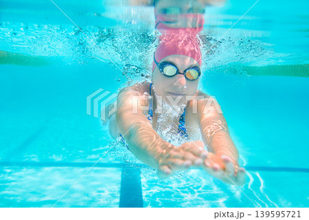 Sports, underwater or woman in swimming pool for competition training, workout or energy. Fitness, female swimmer and fast athlete diving for cardio exercise, championship and race practice at gala 139595721