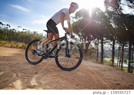 Man, cyclist and mountain bicycle for training, exercise and energy for rider, cycling and sport. Outdoor, hobby and fitness in nature, trail and active for wellness, helmet and physical workout Man, cyclist and mountain bicycle for training, exercise and energy for rider, cycling and sport. Outdoor, hobby and fitness in nature, trail and active for wellness, helmet and physical workout 139595727