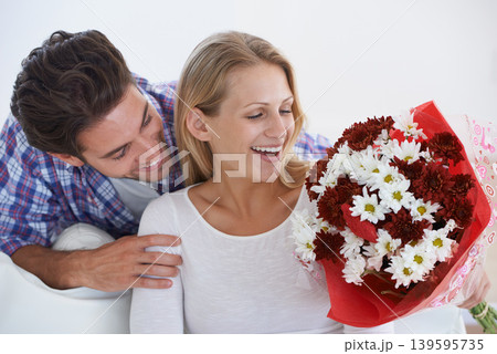 Wow, surprise or happy couple with flowers in home with hug or care for anniversary celebration. Giving a gift, romance or bouquet for love, present and valentines day with romantic gesture and smile Wow, surprise or happy couple with flowers in home with hug or care for anniversary celebration. Giving a gift, romance or bouquet for love, present and valentines day with romantic gesture and smile 139595735
