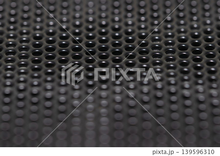 Black perforated metal mesh background with shallow depth of field Black perforated metal mesh background with shallow depth of field 139596310